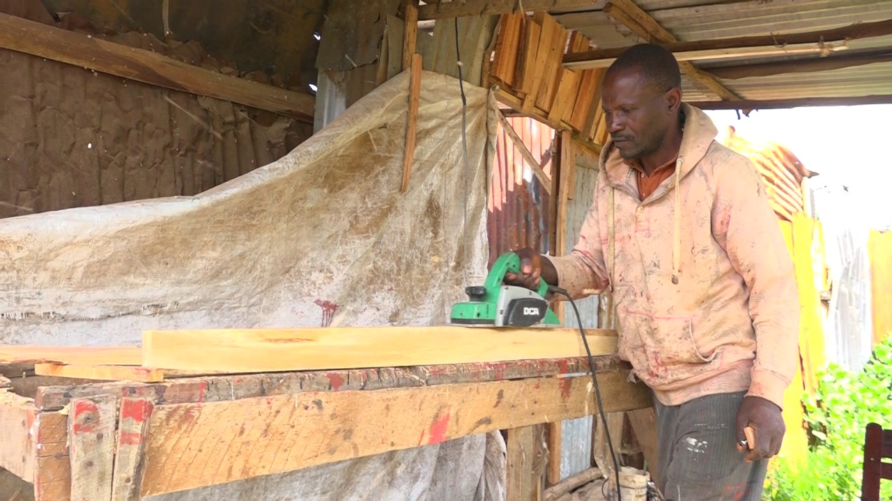 Selestine Hagenimana, a carpenter at work in his Limuru yard in Kiambu County